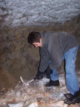 Aluiqsi Gerke cleaning out the ice cellar