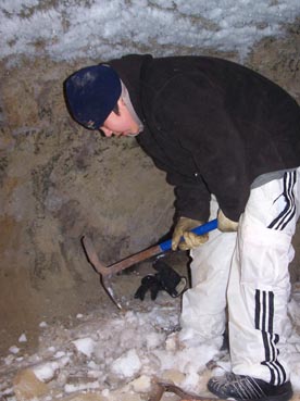 Ben Roy Sage removing dirty snow in the ice cellar